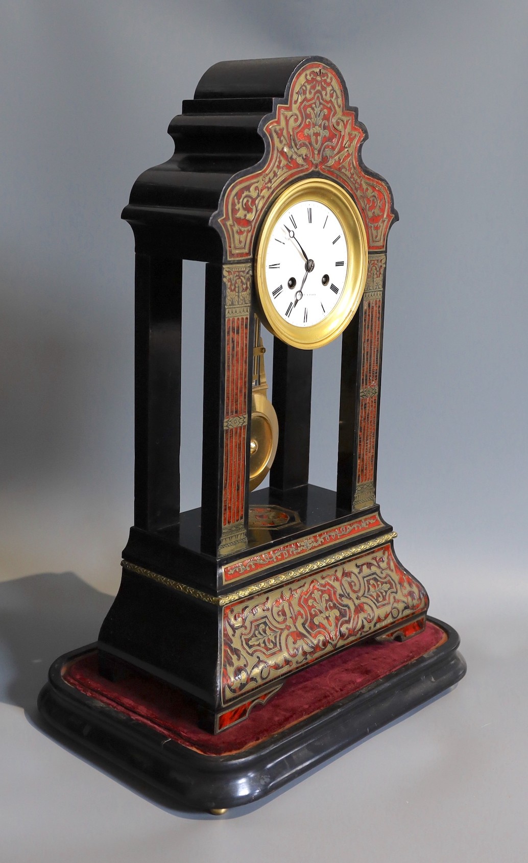 A 19th century French boulle work portico mantel clock, under glass dome, height 50cm